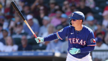 Joc Pederson of the Texas Rangers bats Joc Pederson #4 of the Texas Rangers during the second inning of the MLB game at Surprise Stadium.