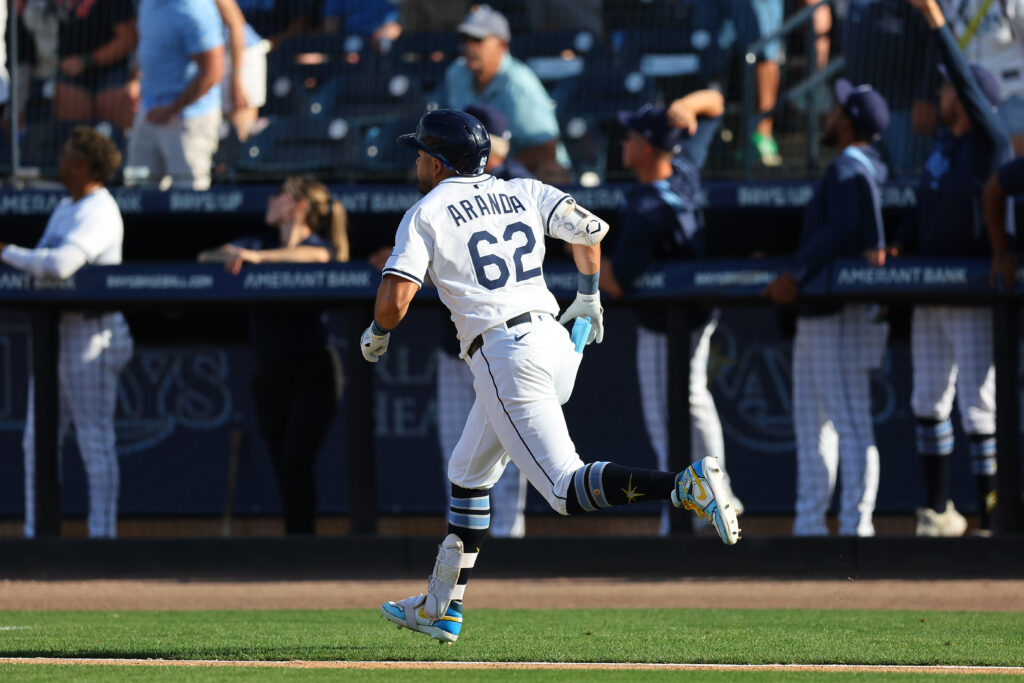 TAMPA, FL - MARCH 28: Jonathan Aranda #62 of the Tampa Bay Rays hits a sacrifice fly in the top of the seventh inning during the game between the Colorado Rockies and the Tampa Bay Rays at George M. Steinbrenner Field on Friday, March 28, 2025 in Tampa, Florida. (Photo by Mike Carlson/MLB Photos via Getty Images)