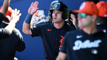 Kevin McGonigle of the Detroit Tigers celebrates with teammates after scoring on a two-run double hit by Thayron Liranzo during the seventh inning of a spring training game against the Atlanta Braves at CoolToday Park.