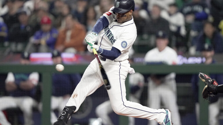 Jorge Polanco of the Seattle Mariners hits a single in the second inning against the Athletics on Opening Day at T-Mobile Park.