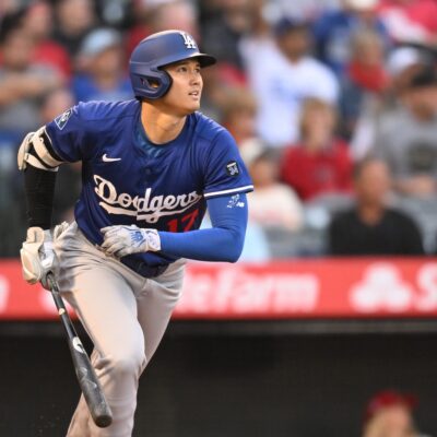 Shohei Ohtani of the Los Angeles Dodgers gets a double in the third inning in a spring training game against the Los Angeles Angels at Angel Stadium of Anaheim.
