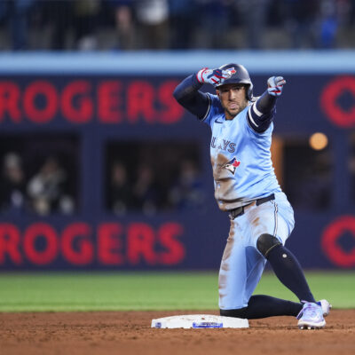 TORONTO, ON - MARCH 31: George Springer #4 of Toronto Blue Jays celebrates his double against the Washington Nationals during the sixth inning in their MLB game at the Rogers Centre on March 31, 2025 in Toronto, Ontario, Canada. (Photo by Mark Blinch/Getty Images)