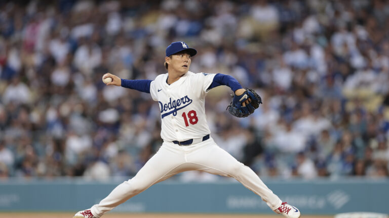 LOS ANGELES, CALIFORNIA - APRIL 11: Yoshinobu Yamamoto #18 of the Los Angeles Dodgers throws against the Chicago Cubs in the first inning at Dodger Stadium on April 11, 2025 in Los Angeles, California. (Photo by Ronald Martinez/Getty Images)