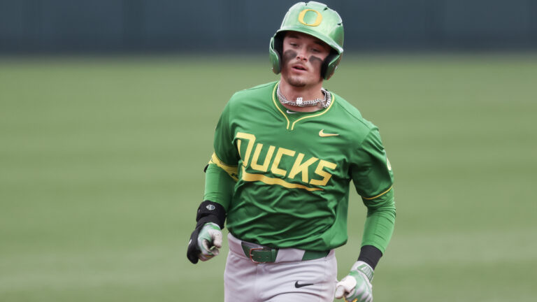 Outfielder Mason Neville of the Oregon Ducks runs the bases after hitting a home run during the fourth inning against the Oregon State Beavers at Goss Stadium.