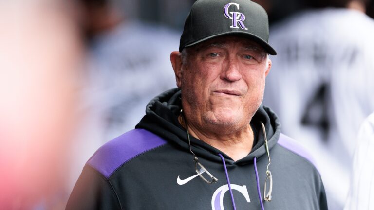 Hitting coach Clint Hurdle of the Colorado Rockies looks on in the dugout during the fifth inning against the Washington Nationals at Coors Field.