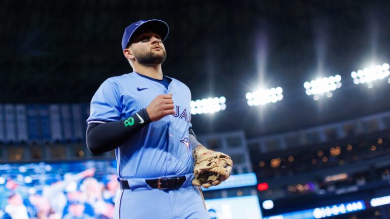 TORONTO, CANADA - APRIL 1: Bo Bichette #11 of the Toronto Blue Jays takes the field ahead of their MLB game against the Washington Nationals at Rogers Centre on April 1, 2025 in Toronto, Canada. (Photo by Cole Burston/Getty Images)
