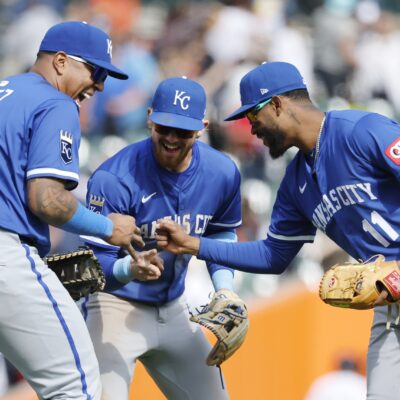 DETROIT, MI - APRIL 20: Salvador Perez #13 of the Kansas City Royals, Bobby Witt Jr. #7 and Maikel Garcia #11 celebrate after a 4-3 win over the Detroit Tigers in 10 innings at Comerica Park on April 20, 2025 in Detroit, Michigan. (Photo by Duane Burleson/Getty Images)
