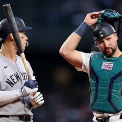 SEATTLE, WASHINGTON - MAY 13: Cal Raleigh #29 of the Seattle Mariners looks on while standing next to Aaron Judge #99 of the New York Yankees at T-Mobile Park on May 13, 2025 in Seattle, Washington. (Photo by Steph Chambers/Getty Images)
