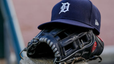 DETROIT, MICHIGAN - JUNE 25: A detail of a New Era Detroit Tigers baseball hat and Rawlings baseball glove during the game against the Athletics at Comerica Park on June 25, 2025 in Detroit, Michigan. (Photo by Nic Antaya/Getty Images)