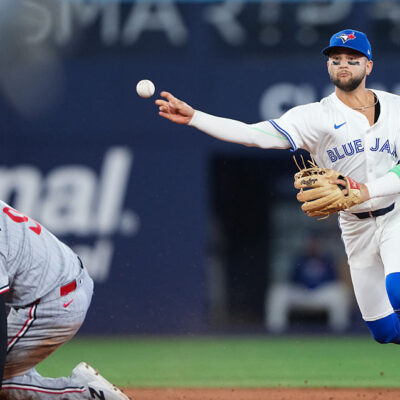 TORONTO, ON - AUGUST 25: Bo Bichette #11 of the Toronto Blue Jays throws to first after tagging out Trevor Larnach #9 of the Minnesota Twins at second in the eighth inning during the game between the Minnesota Twins and the Toronto Blue Jays at Rogers Centre on Monday, August 25, 2025 in Toronto, Ontario, Canada. (Photo by Thomas Skrlj/MLB Photos via Getty Images)