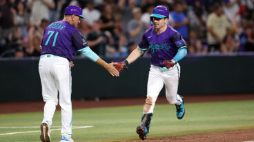 PHOENIX, ARIZONA - SEPTEMBER 05: Corbin Carroll #7 high fives third base coach Tim Bogar #71 of the Arizona Diamondbacks after hitting a three run home run against the Boston Red Sox during the eighth inning at Chase Field on September 05, 2025 in Phoenix, Arizona. The Diamondbacks defeated the Red Sox 10-5. (Photo by Chris Coduto/Getty Images)