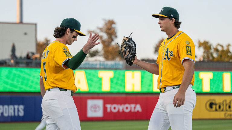 SACRAMENTO, CALIFORNIA - SEPTEMBER 12: Jacob Wilson #5 and Nick Kurtz #16 of the Athletics high five before a game against the Cincinnati Reds at Sutter Health Park on September 12, 2025 in Sacramento, California. (Photo by Justine Willard/Athletics/Getty Images)