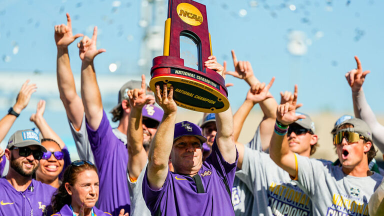 OMAHA, NEBRASKA - JUNE 22: Head coach Jay Johnson of the LSU Tigers hoists the championship trophy after defeating the Coastal Carolina Chanticleers to win the NCAA College World Series baseball finals at Charles Schwab Field on June 22, 2025 in Omaha, Nebraska. (Photo by Jay Biggerstaff/Getty Images)