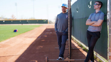 SURPRISE, AZ - FEBRUARY 21: Skip Schumaker, Senior Advisor of Baseball Operations, looks on with Mike Parnell, Senior Director of Professional Scouting, during a spring training workout at Surprise Stadium on February 21, 2025 in Surprise, Arizona. (Photo by Bailey Orr/Texas Rangers/Getty Images)