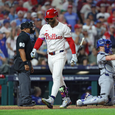 PHILADELPHIA, PENNSYLVANIA - OCTOBER 06: Bryce Harper #3 of the Philadelphia Phillies walks to the dugout after striking out during the sixth inning against the Los Angeles Dodgers in game two of the National League Division Series at Citizens Bank Park on October 06, 2025 in Philadelphia, Pennsylvania. (Photo by Emilee Chinn/Getty Images)