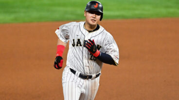 MIAMI, FLORIDA - MARCH 21: Kazuma Okamoto #25 of Team Japan hits a solo homerun in the bottom of the fourth inning during World Baseball Classic Championship between United States and Japan at loanDepot park on March 21, 2023 in Miami, Florida. (Photo by Gene Wang/Getty Images)