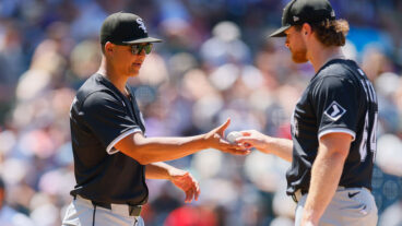 DENVER, CO - JULY 6: Manager Will Venable #1 of the Chicago White Sox takes the baseball from Shane Smith #64 as he exits the game in the fifth inning against the Colorado Rockies at Coors Field on July 6, 2025 in Denver, Colorado. (Photo by Justin Edmonds/Getty Images)