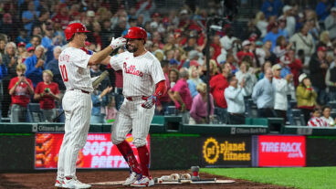 PHILADELPHIA, PENNSYLVANIA - SEPTEMBER 9: Kyle Schwarber #12 of the Philadelphia Phillies celebrates with J.T. Realmuto #10 after hitting a three run home run in the bottom of the seventh inning against the New York Mets at Citizens Bank Park on September 9, 2025 in Philadelphia, Pennsylvania. The home run was the 50th on the season for Kyle Schwarber. The Phillies defeated the Mets 9-3. (Photo by Mitchell Leff/Getty Images)