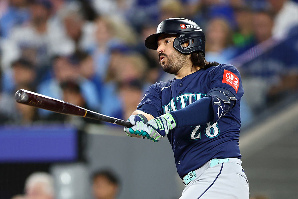 TORONTO, ONTARIO - OCTOBER 20: Eugenio Suarez #28 of the Seattle Mariners hits a single during the second inning against the Toronto Blue Jays in game seven of the American League Championship Series at the Rogers Centre on October 20, 2025 in Toronto, Ontario. (Photo by Vaughn Ridley/Getty Images)