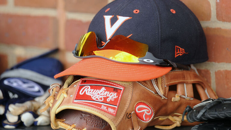 CHARLOTTESVILLE, VA - JUNE 9: Virginia Cavaliers cap and glove in the dug out before the NCAA Baeball Super Regional against the Maryland Terrapins on June 9, 2014 at Davenport Field in Charlottesville, Virginia. (Photo by Mitchell Layton/Getty Images)