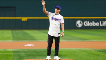 ARLINGTON, TX - JULY 22: First Round Draft pick of the Texas Rangers, Gavin Fien, throws the ceremonial first pitch prior to a game between the Texas Rangers and the Athletics at Globe Life Field on July 22, 2025 in Arlington, Texas. (Photo by Gunnar Word/Texas Rangers/Getty Images)