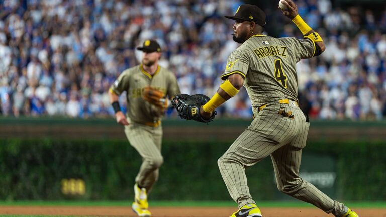 CHICAGO, ILLINOIS - OCTOBER 2: Luis Arraez #4 of the San Diego Padres throws the ball to home plate during game three of the National League Wild Card Series against the Chicago Cubs at Wrigley Field on October 2, 2025 in Chicago, Illinois. (Photo by Matt Thomas/San Diego Padres/Getty Images)
