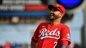 CINCINNATI, OH - JULY 3: Eugenio Suárez #7 of the Cincinnati Reds is amused by a fan during a game against the Chicago Cubs at Great American Ball Park on July 3, 2021 in Cincinnati, Ohio. (Photo by Jamie Sabau/Getty Images)