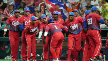 MIAMI, FLORIDA - MARCH 19: Roel Santos #1 of Team Cuba celebrates with teammates after scoring in the first inning against Team USA during the World Baseball Classic Semifinals at loanDepot park on March 19, 2023 in Miami, Florida. (Photo by Eric Espada/Getty Images)