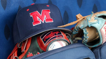 HOOVER, AL - MAY 23: A hat with the Ole Miss logo and glove sit in the dugout before the SEC Baseball Tournament Quarterfinals game between Mississippi Rebels and Arkansas Razorbacks on May 23, 2025, at Hoover Metropolitan Stadium in Hoover, Alabama. (Photo by David Buono/Icon Sportswire via Getty Images)