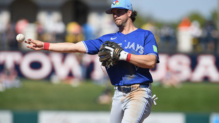 LAKELAND, FLORIDA - FEBRUARY 25: Ernie Clement #22 of the Toronto Blue Jays throws a runner out at first during a spring training game against the Detroit Tigers at Publix Field at Joker Marchant Stadium on February 25, 2026 in Lakeland, Florida. (Photo by Mark Taylor/Getty Images)