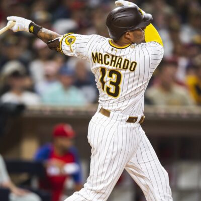 Manny Machado #13 of the San Diego Padres hits a home run in the third inning against the Philadelphia Phillies.