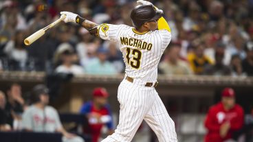 Manny Machado #13 of the San Diego Padres hits a home run in the third inning against the Philadelphia Phillies.