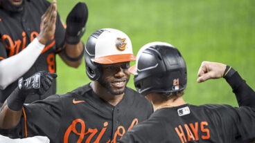Baltimore Orioles center fielder Cedric Mullins (31) is congratulated by left fielder Austin Hays (21) after hitting a 3 run home run in the second inning to become the first player in Orioles history with 30 home runs and 30 stolen bases during the Texas Rangers game versus the Baltimore Orioles on September 24, 2021 at Orioles Park at Camden Yards.