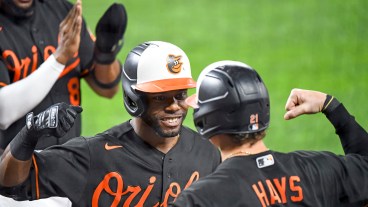 Baltimore Orioles center fielder Cedric Mullins (31) is congratulated by left fielder Austin Hays (21) after hitting a 3 run home run in the second inning to become the first player in Orioles history with 30 home runs and 30 stolen bases during the Texas Rangers game versus the Baltimore Orioles on September 24, 2021 at Orioles Park at Camden Yards.