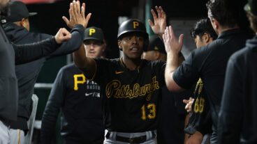 Ke'Bryan Hayes of the Pittsburgh Pirates celebrates after scoring in the 5th inning against the Cincinnati Reds at Great American Ball Park.