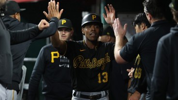 Ke'Bryan Hayes of the Pittsburgh Pirates celebrates after scoring in the 5th inning against the Cincinnati Reds at Great American Ball Park.