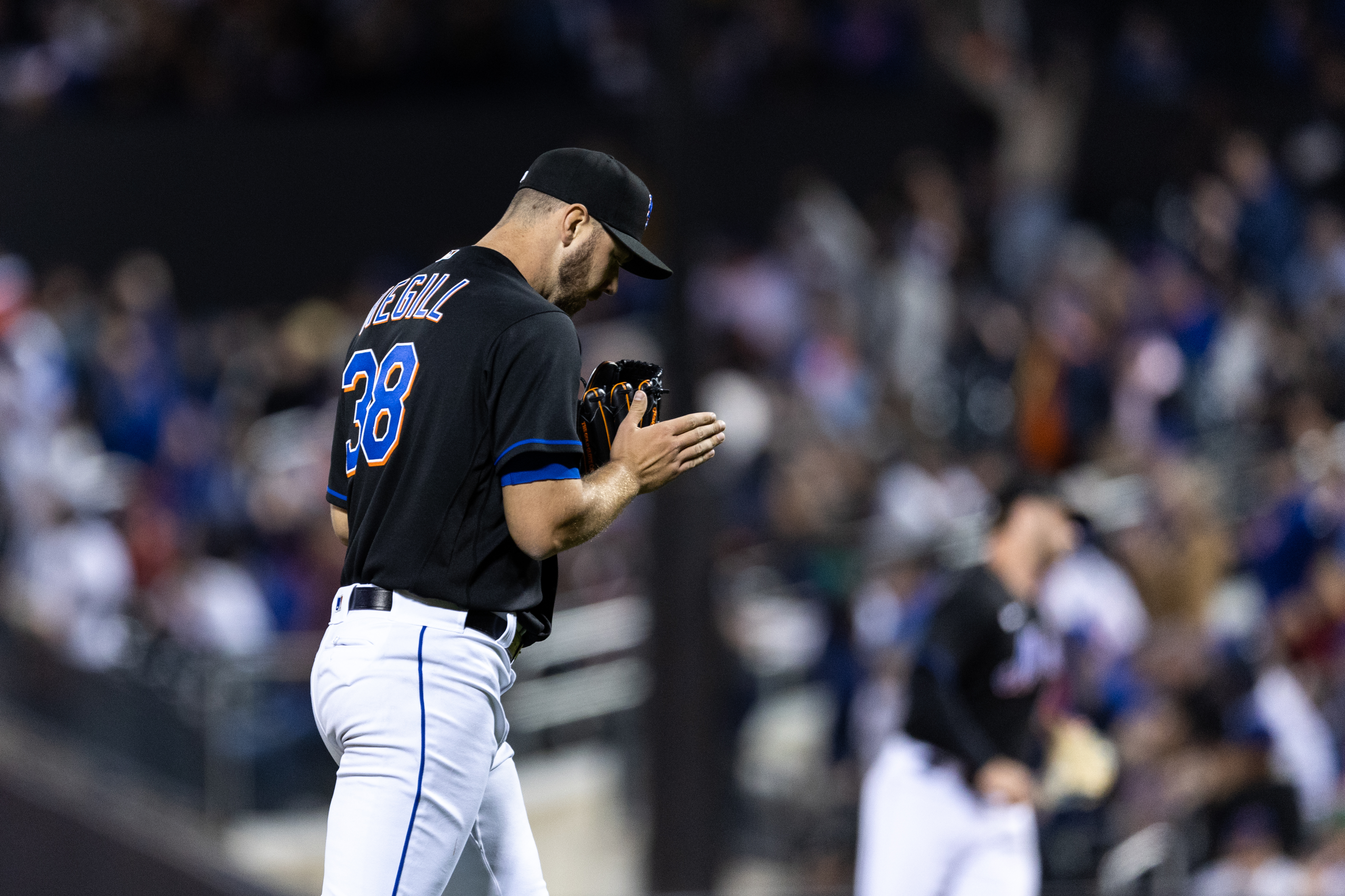 Tylor Megill of the New York Mets reacts at the third inning of the game against the Philadelphia Phillies at Citi Field.