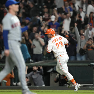 Joc Pederson of the San Francisco Giants trots around the bases after hitting a three-run home run. Could Joc Pederson return to his former team in free agency?