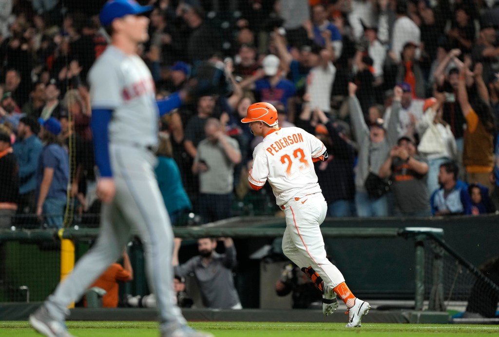 Joc Pederson of the San Francisco Giants trots around the bases after hitting a three-run home run. Could Joc Pederson return to his former team in free agency?