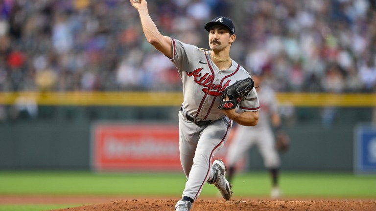 Spencer Strider of the Atlanta Braves pitches against the Colorado Rockies at Coors Field.