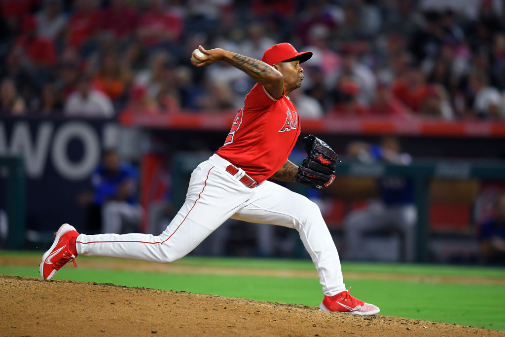 ANAHEIM, CA - JULY 30: Raisel Iglesias #32 of the Los Angeles Angels pitches while playing the Texas Rangers at Angel Stadium of Anaheim on July 30, 2022 in Anaheim, California. (Photo by John McCoy/Getty Images)