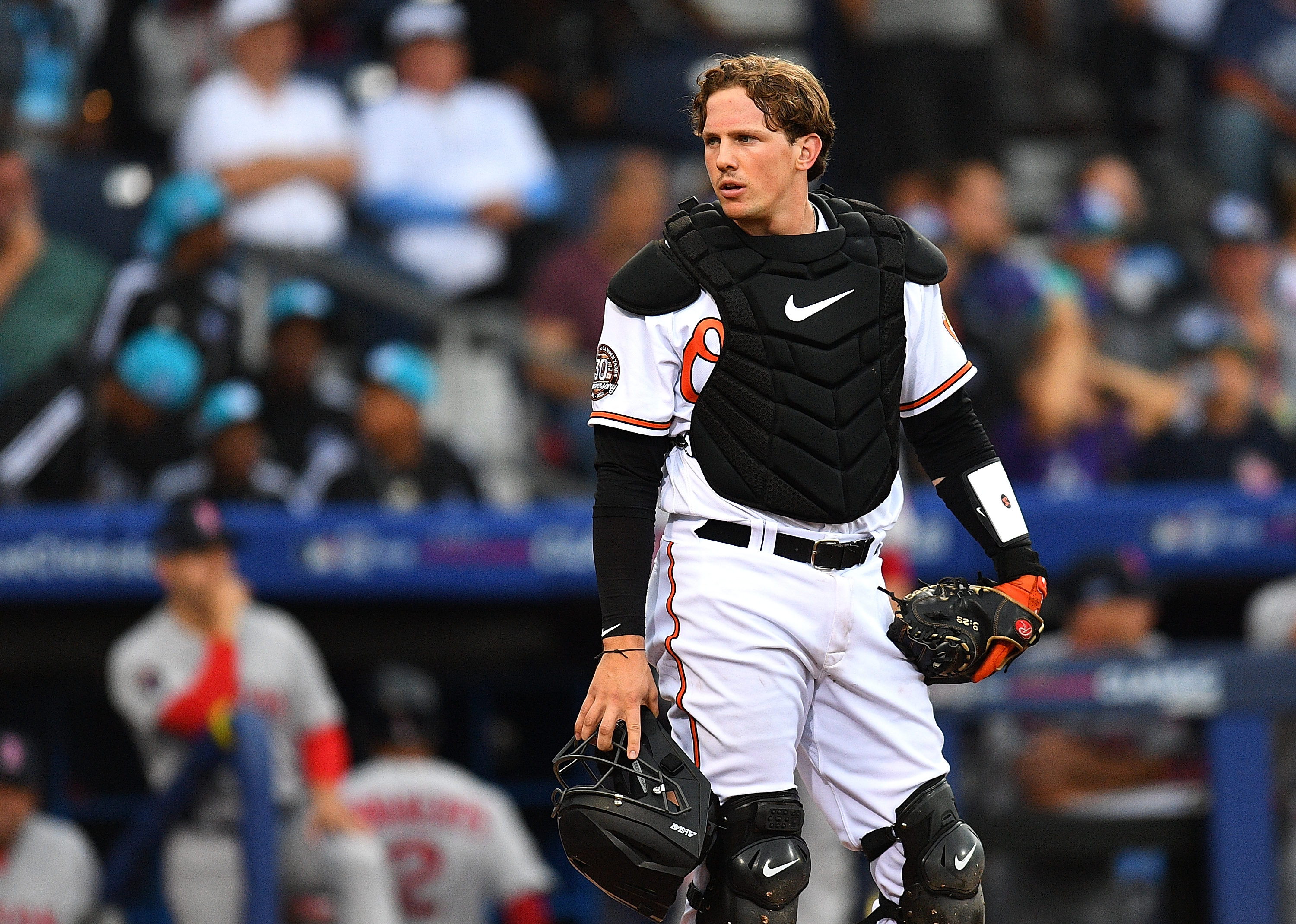 Adley Rutschman of the Baltimore Orioles looks on during the game against the Boston Red Sox at Bowman Field.