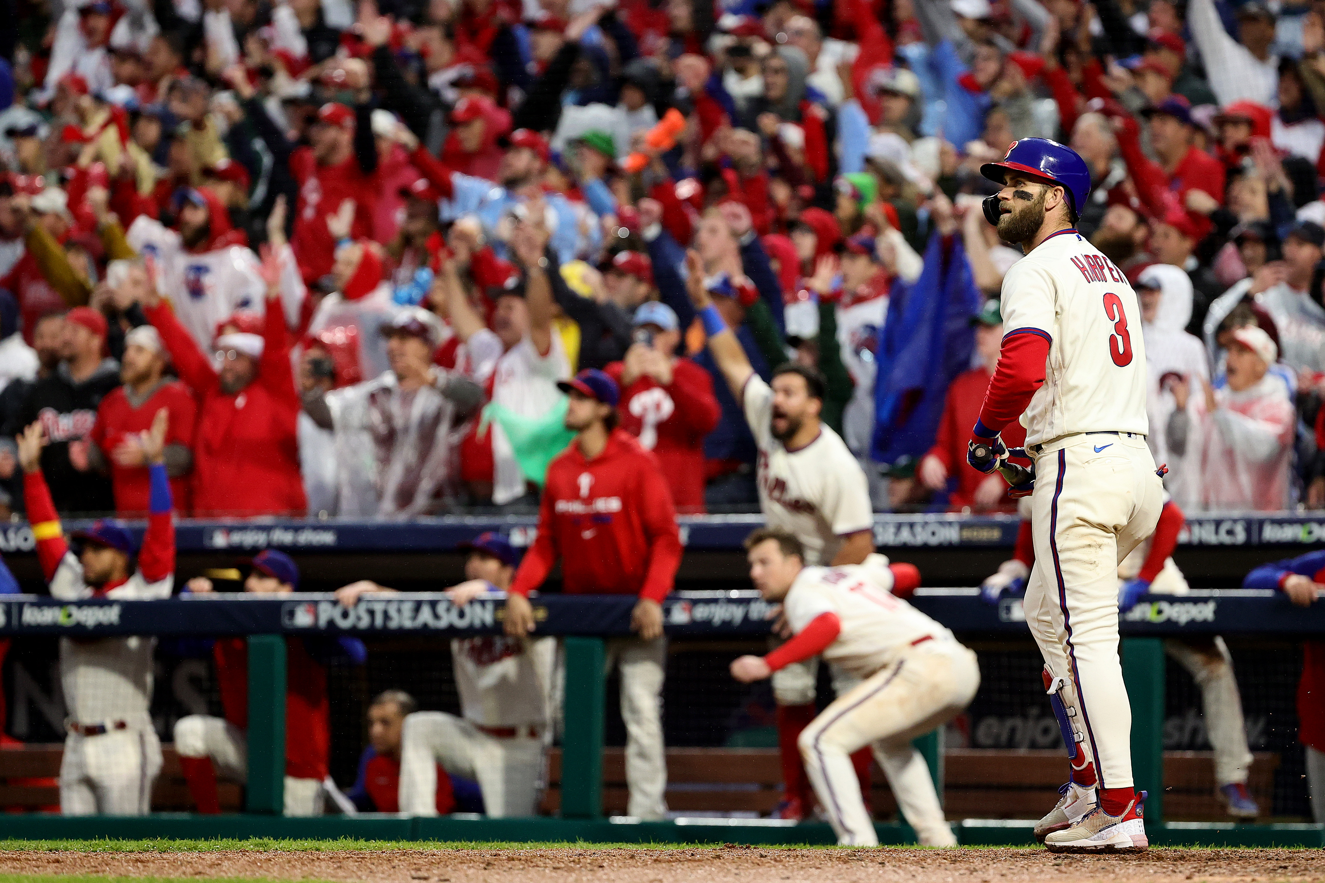 Bryce Harper of the Philadelphia Phillies hits a two run home run during the eighth inning against the San Diego Padres in game five of the National League Championship Series at Citizens Bank Park.