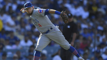 LOS ANGELES, CA - JUNE 27: Eric Sogard (4) of the Chicago Cubs makes a throw to first base while playing the Los Angeles Dodgers on June 27, 2021 at Dodger Stadium in Los Angeles, CA.(Photo by John McCoy/Icon Sportswire via Getty Images)