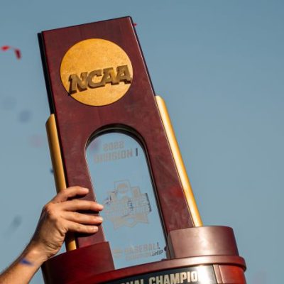 OMAHA, NE - June 26: The National Championship trophy is lifted by the Ole Miss Rebels after winning the Men's College World Series game at Charles Schwab Field on June 26, 2022 in Omaha, Nebraska. Ole Miss defeated Oklahoma in the second game of the championship series to win the National Championship. (Photo by Eric Francis/Getty Images)