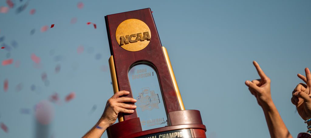 OMAHA, NE - June 26: The National Championship trophy is lifted by the Ole Miss Rebels after winning the Men's College World Series game at Charles Schwab Field on June 26, 2022 in Omaha, Nebraska. Ole Miss defeated Oklahoma in the second game of the championship series to win the National Championship. (Photo by Eric Francis/Getty Images)