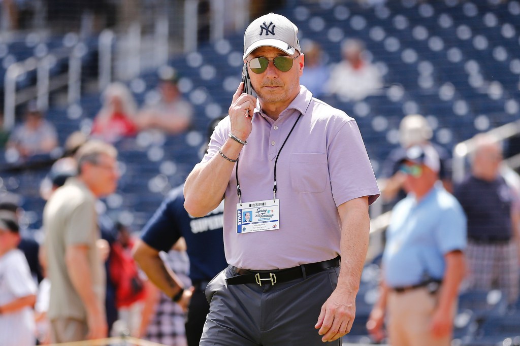 WEST PALM BEACH, FLORIDA - MARCH 12: New York Yankees general manager Brian Cashman talks on the phone prior to a Grapefruit League spring training game between the Washington Nationals and the New York Yankees at FITTEAM Ballpark of The Palm Beaches on March 12, 2020 in West Palm Beach, Florida. Many professional and college sports are canceling or postponing their games due to the ongoing threat of the Coronavirus (COVID-19) outbreak. (Photo by Michael Reaves/Getty Images)