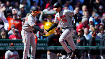 Adley Rutschman of the Baltimore Orioles rounds the bases after hitting a solo home run in the first inning during the game between the Baltimore Orioles and the Boston Red Sox at Fenway Park.