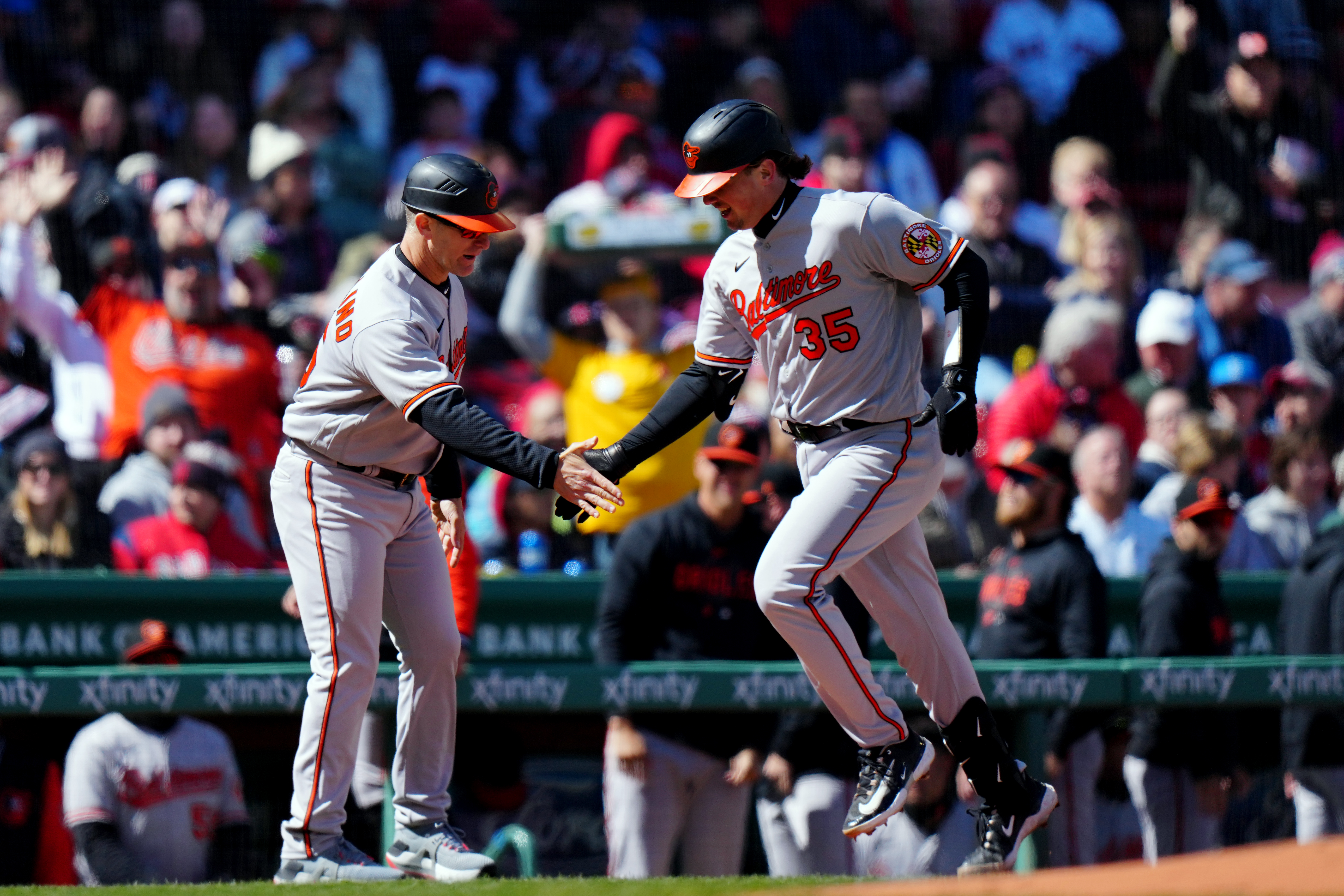 Adley Rutschman of the Baltimore Orioles rounds the bases after hitting a solo home run in the first inning during the game between the Baltimore Orioles and the Boston Red Sox at Fenway Park.