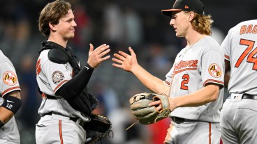 Adley Rutschman #35 and Gunnar Henderson #2 of the Baltimore Orioles celebrate the team's 4-0 win over the Cleveland Guardians in Henderson's Major League debut at Progressive Field on August 31, 2022 in Cleveland, Ohio. (Photo by Nick Cammett/Diamond Images via Getty Images)
